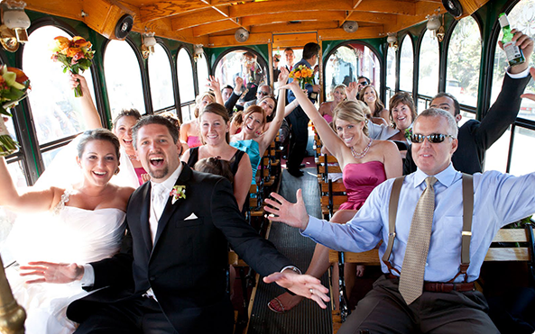 Wedding Party in Trolley Philadelphia Decorated Bride Groom Best Man Maid of Honor arms up Rental fowers