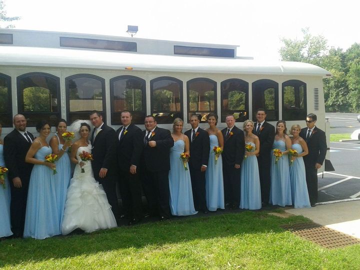 White Trolley Rental Philadelphia Wedding Party Bridemaids Grooms Men Best Man Bride Groom Red Yellow Flowers outside Transportation